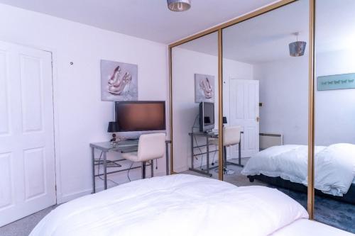 Ένα ή περισσότερα κρεβάτια σε δωμάτιο στο Blissful Oasis