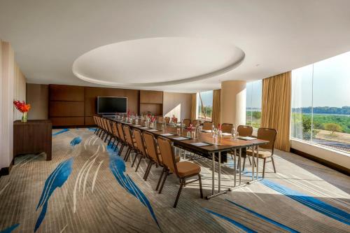a conference room with a long table and chairs at Amari Vientiane in Vientiane