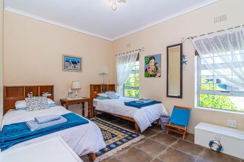 Ένα ή περισσότερα κρεβάτια σε δωμάτιο στο Island View - Franskraal