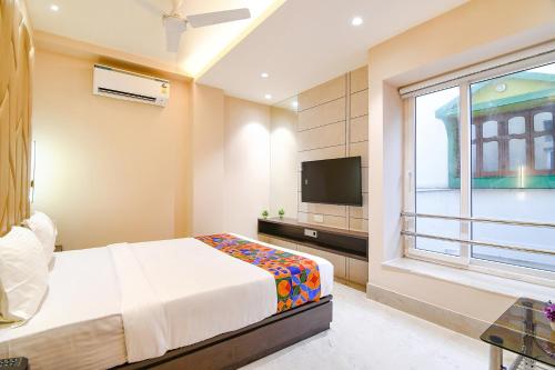 Katil atau katil-katil dalam bilik di FabHotel Samotel - Nr Kolkata Airport