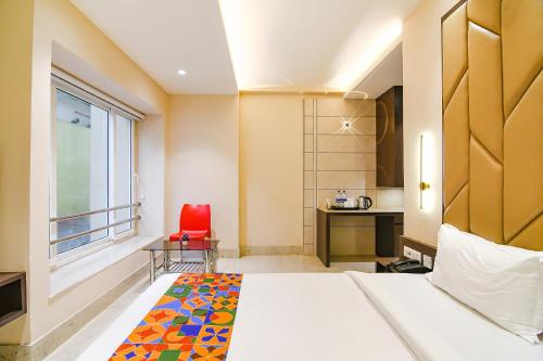 Katil atau katil-katil dalam bilik di FabHotel Samotel - Nr Kolkata Airport
