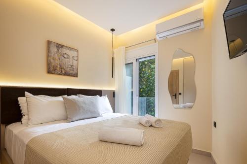 Ένα ή περισσότερα κρεβάτια σε δωμάτιο στο Aelia City Suites