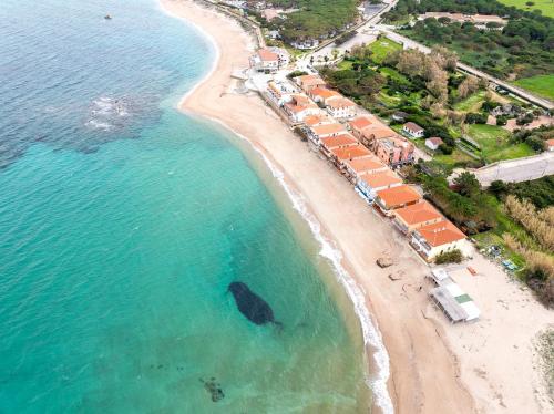 an aerial view of a beach with a resort at Gallura style Res Baia Del Mirti B4 1BedAp sleeps4 in Vignola Mare