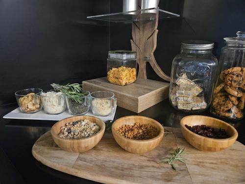 a group of bowls of food on a table at Hotel 3K Europa in Lisbon
