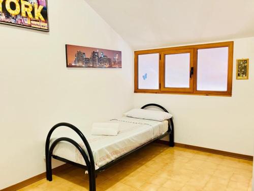 Postel nebo postele na pokoji v ubytování Appartamento accogliente a pochi minuti dal mare