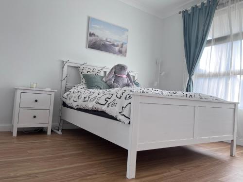 a bedroom with a white bed and a white dresser at Private room & private toilet in Clearview in Gepps Cross