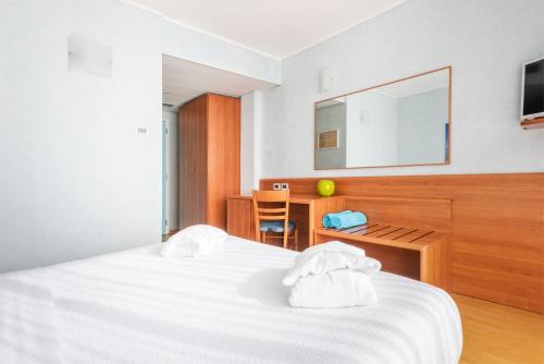Postel nebo postele na pokoji v ubytování Hotel Gabry