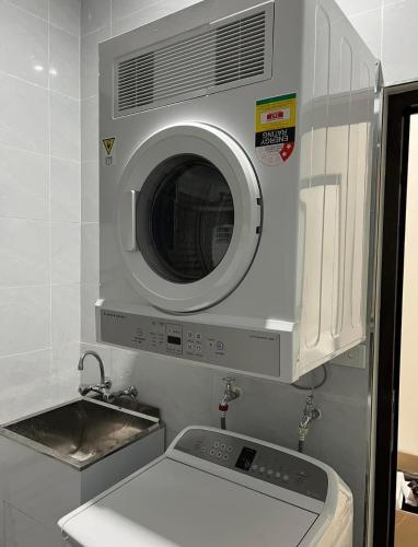 a washing machine in a kitchen with a sink at Waiyavi bnb Homestay in Lautoka