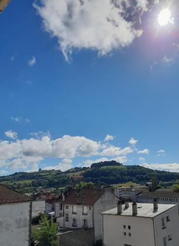 a view of a city with buildings and the sky at Appartement T3 - Vue dégagée - Parking in Aurillac