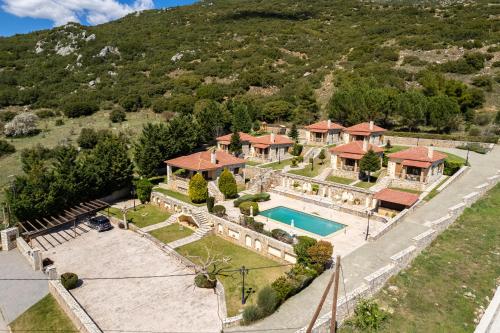 an aerial view of a house with a swimming pool at Pleiades Studios All Season Gems - Korinthos Stone Retreats in Kalianoi