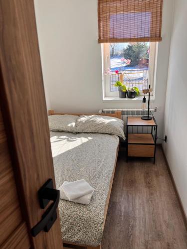 Postel nebo postele na pokoji v ubytování Apartament numer 1, dwie sypialnie dwa łóżka
