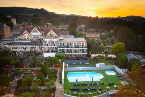 an aerial view of a mansion with a swimming pool at Luccombe Hall Hotel in Shanklin