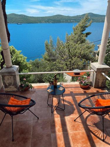 a patio with a view of the water at Kia apartman in Prljevići