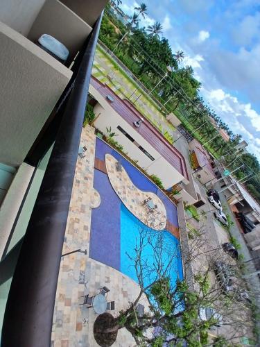a large mural on the side of a building at MALIA MURO ALTO STUDIO 300m DO MAR in Porto De Galinhas