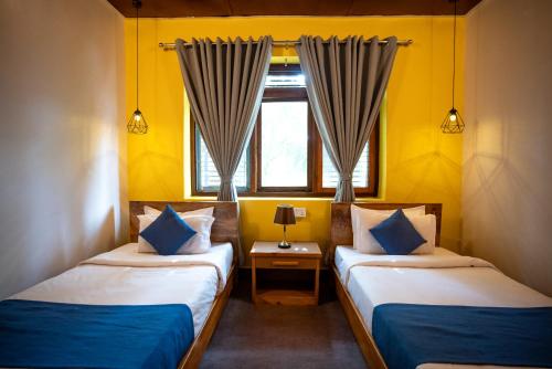 Krevet ili kreveti u jedinici u okviru objekta Gaurishankar Backpackers hostel