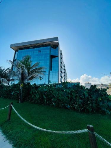 a building with a chain in front of it at Ritz Paradise Beira Mar no Hotel Ritz Suítes in Maceió