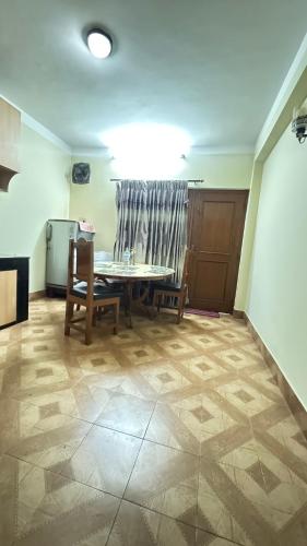 a dining room with a table and two chairs at Neupane's Homestay in Kathmandu