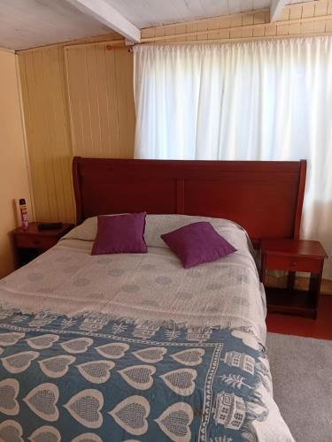 Ένα ή περισσότερα κρεβάτια σε δωμάτιο στο Cisnes del Tolten