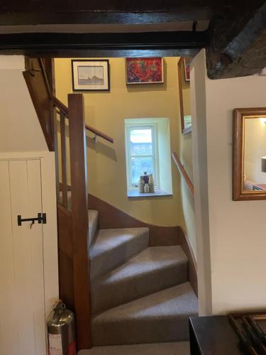 a set of stairs in a tiny house at The Stable Rooms in Kirk Ireton