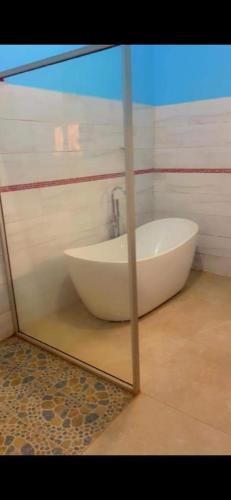 a reflection of a bath tub in a mirror at NÉFERTITi in Yaoundé