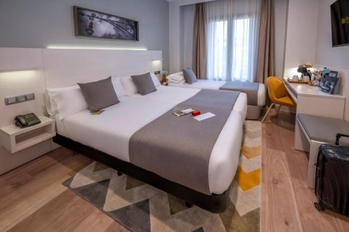 SERHS Carlit Boutique Hotelにあるベッド