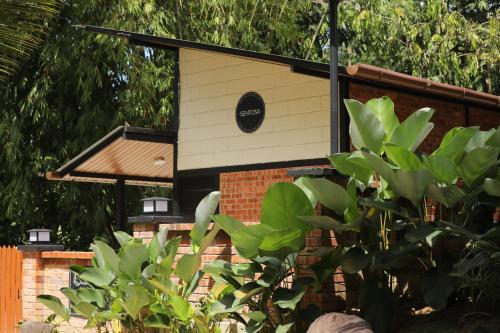 a bird house sitting on top of a brick building at Casa Damai Janda Baik - RIVERVIEW TINY HOUSE in Bentong