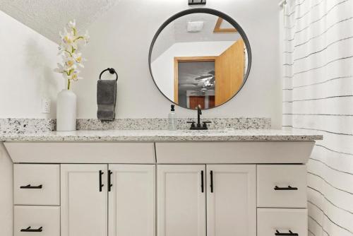 a bathroom with a sink and a mirror at Hidden Haven in Traverse City