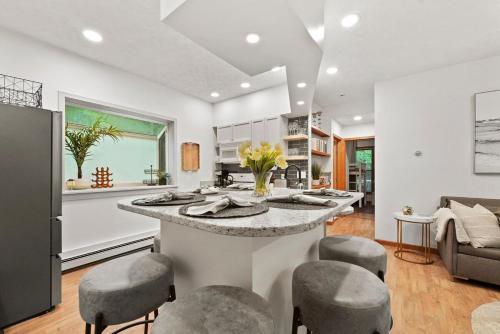 a kitchen with a large island in the middle of a room at Hidden Haven in Traverse City
