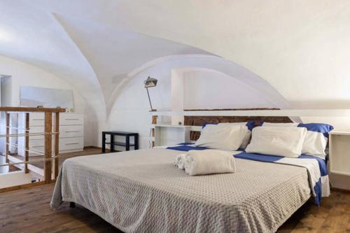 En eller flere senge i et værelse på La Salita Di San Camillo