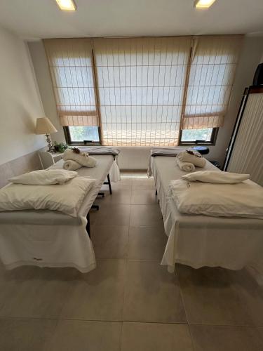 Postel nebo postele na pokoji v ubytování Villa La Font Apart Hotel & Spa
