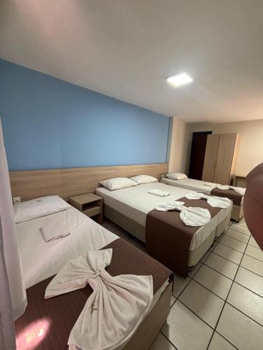 Una cama o camas en una habitación de Executivo Prime Hotel