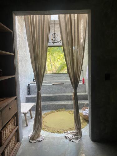 Ένα ή περισσότερα κρεβάτια σε δωμάτιο στο Casa Sabina en Francisco Uh May