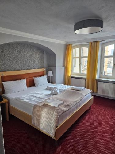 Postel nebo postele na pokoji v ubytování Hotel Goldene Rose