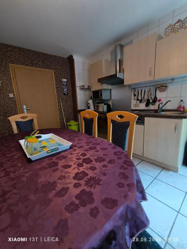 a kitchen with a table with a plate on it at Ferienwohnung Horst Schäfer in Idar-Oberstein