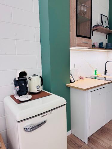 a kitchen with a counter with a tea kettle on it at Апартаменти Dream Space in Khmelʼnytsʼkyy
