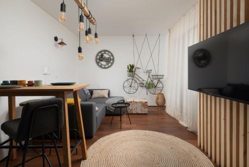 a living room with a couch and a table at Holiday HOME Zadar DIKLO in Zadar