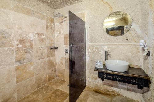 a bathroom with a sink and a mirror at Angel View Suites in Goreme