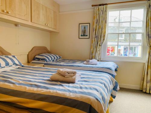 Postel nebo postele na pokoji v ubytování Maypole Cottages - No 12 Broad Street