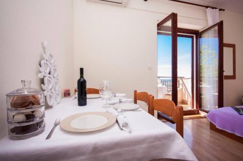Ένα ή περισσότερα κρεβάτια σε δωμάτιο στο Family Apartments & Rooms Mikelin