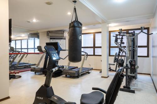 a gym with a punching bag hanging from the ceiling at Park Tower Campinas Residence by Nacional Inn in Campinas