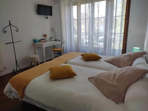 Katil atau katil-katil dalam bilik di B&B Amphitryon
