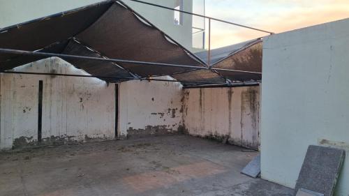 an empty room with a roof in a building at Don Roque II in Santa Rosa
