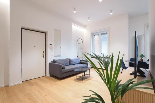 a living room with a couch and a table at Missori Luxury Apartments in Milan
