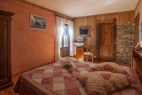 Cama o camas de una habitación en Albergo Boule de Neige