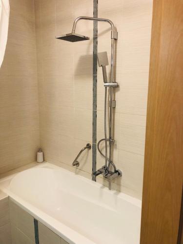 a shower in a bathroom with a white sink at Casa Blanca in Nyíregyháza