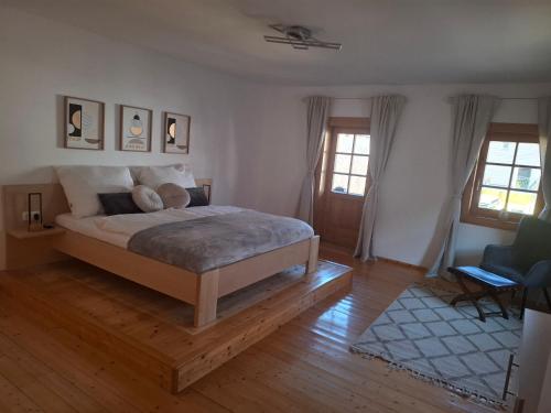 a bedroom with a bed with two teddy bears on it at Ferienhaus Stadt Juwel in Mürzzuschlag
