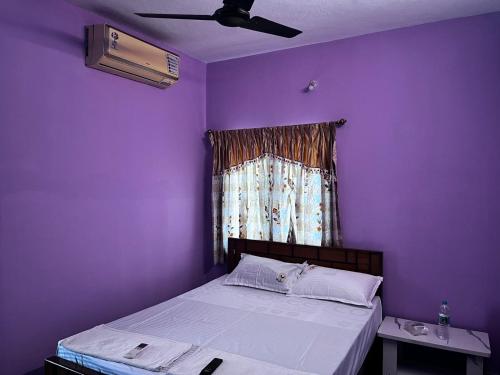 Postel nebo postele na pokoji v ubytování Pearl Homestay Ramapuram