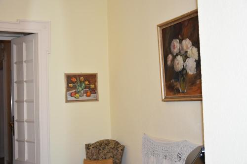 a room with two pictures of flowers on the wall at Casa Santa Birgitta in Lugano