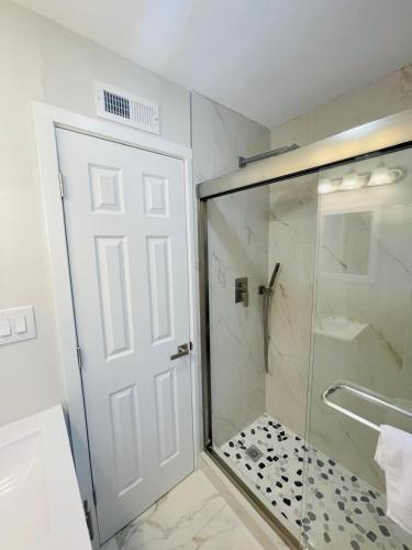 a shower with a glass door in a bathroom at Perfect Vacation walk to the beach 9 in Myrtle Beach