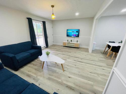a living room with a couch and a tv at Perfect Vacation walk to the beach 9 in Myrtle Beach
